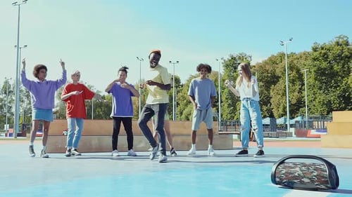 Friends Dancing Together on a Basketball Court