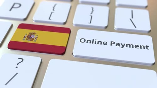 Online Payment Text and Flag of Spain on the Keyboard