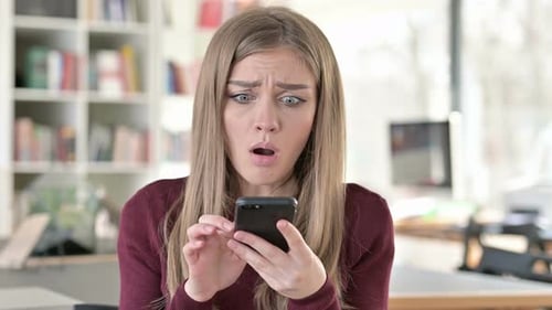 Portrait of Loss on Smartphone By Young Woman