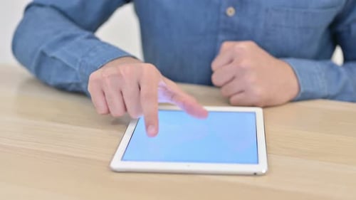 Close Up of Male Hands Using Digital Tablet