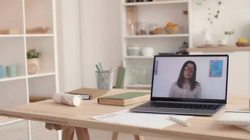 Woman Teaching Online Class on Laptop