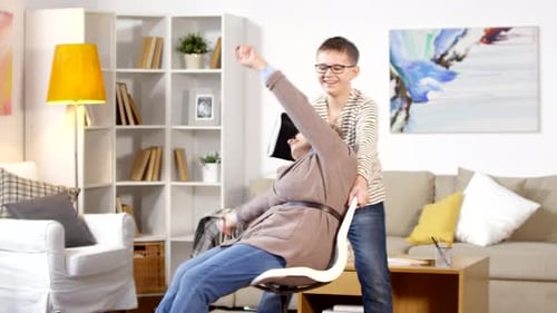 Grandmother Experiencing VR with Grandson's Assistance