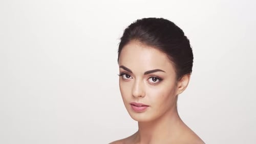 Studio portrait of young and beautiful brunette woman over