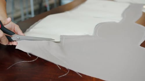 Cutting Fabric for Sewing on a Wooden Table
