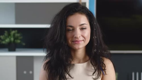 Smiling Young Woman Brunette Looking at Camera at Home Office. Happy Millennial Female with Pretty