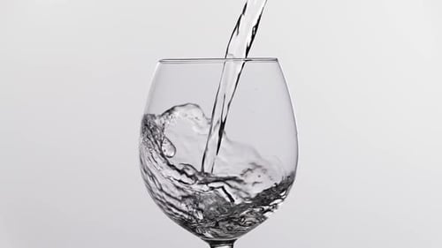 Liquid Pouring Into Wine Glass, Close Up