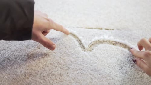 Drawing a Heart in Sand or Granules