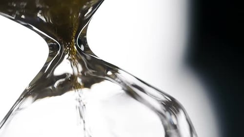Close up of Sand Flowing Through Hourglass