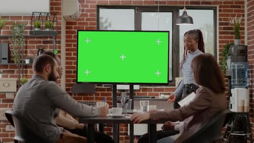 Business People Doing Presentation with Green Screen on Monitor