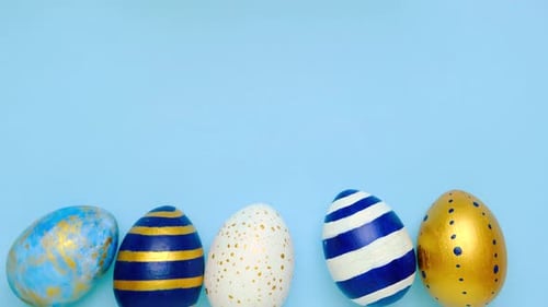 Festive Painted Easter Eggs on Light Blue Background