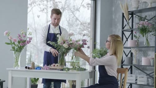 Florists Arranging Flowers Together in a Flower Shop
