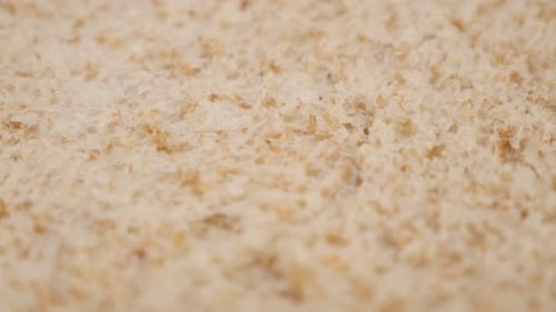 Shallow DOF toast bread whole grain baked surface close-up slow tilt 4K 2160p 30fps UltraHD footage