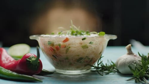 Fresh Hot Noodles in Clear Bowl with Vegetables