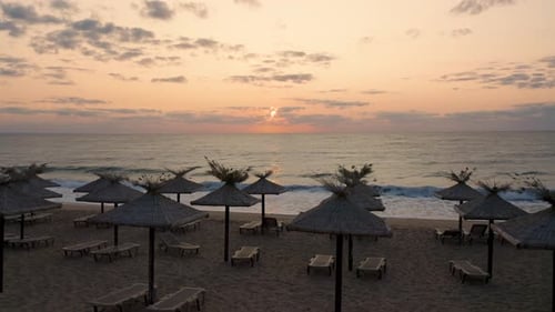 Empty sandy beach at sunrise