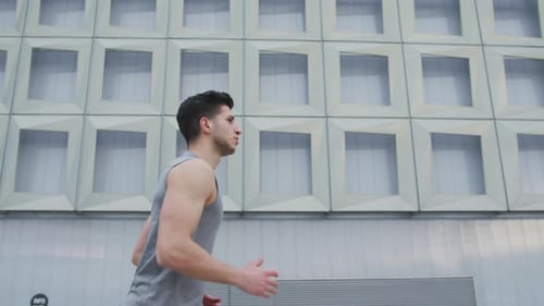 Man Jogging During the Day in Urban Setting