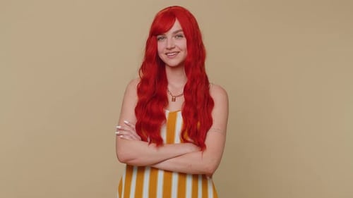 Confident Woman With Wavy Red Hair Smiling