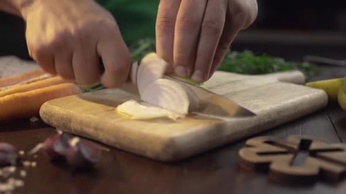 Chef Chops the Onions on the Wooden Board at the Kitchen, Raw Vegetables, Close Up Shot of Cooking