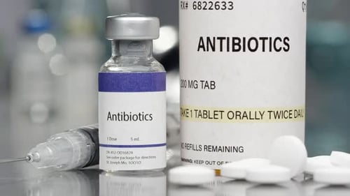 Antibiotic Medicine Vial, Tablets, and Syringe Close Up