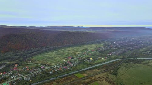 Aerial Top Dow View Over Suburb Area Village Near Mountain High Altitude View Over Countryside of