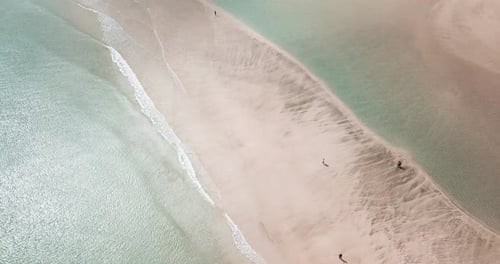 Beautiful beach with sea transparent clean water on both sides. Island concept travel destination.