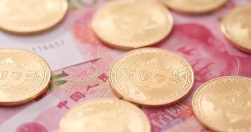 Bitcoin Coins and Chinese Yuan Currency