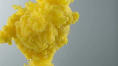 Bright Yellow Ink Blooming in Clear Liquid