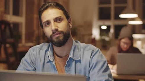 Portrait of Young Handsome Bearded Businessman at Work
