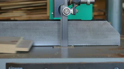 Woodworking Milling Cutter Removes Chamfers From the Edge of a Board with Amount of Sawdust