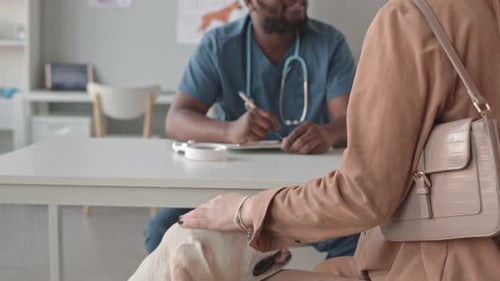 Woman with Dog in Vet Clinic