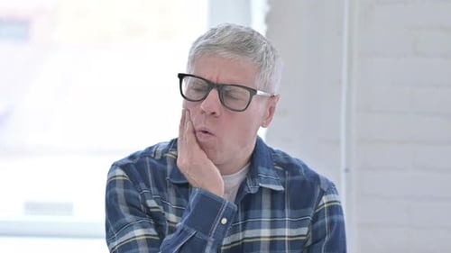 Portrait of Casual Middle Aged Man Having Toothache