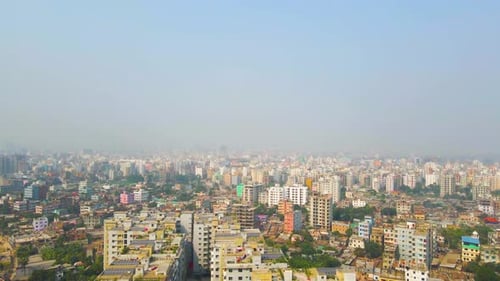 Aerial view over capital city of Bangladesh, Dhaka showing concrete jungle and high rise buildings.
