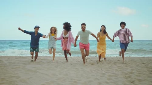 Group of friends having fun on the beach.