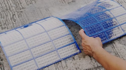 Technician service maintenance to cleaning dirty dust dense on filter air conditioner