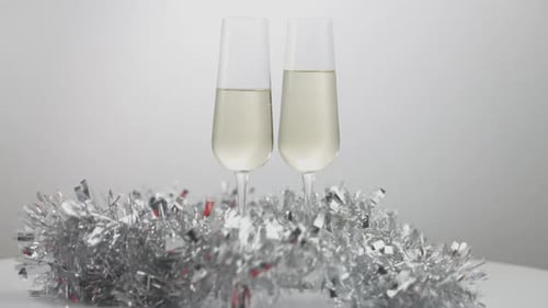 Champagne Glasses with Shiny Tinsel Decoration