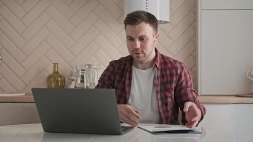Man Working at Home on Laptop, Video Call