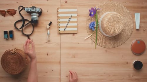 Travel Accessories Laid Out on Wooden Table