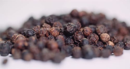 Pile of Dried Black Peppercorns Close Up