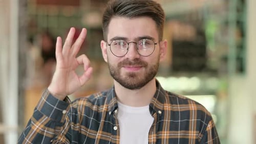 Bearded Man Gives Okay Hand Gesture