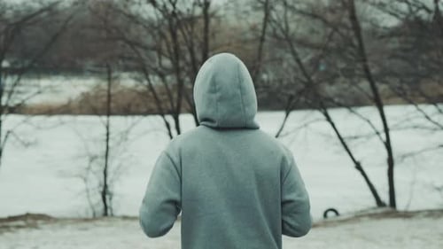 Jogger in park covered with snow