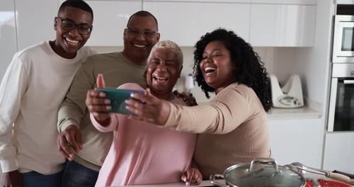 Family Fun Taking Selfie in Modern Kitchen