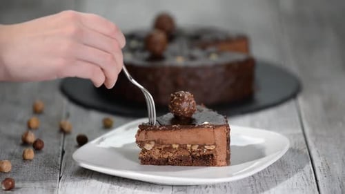 Delicious Slice of Chocolate Cake being Eaten