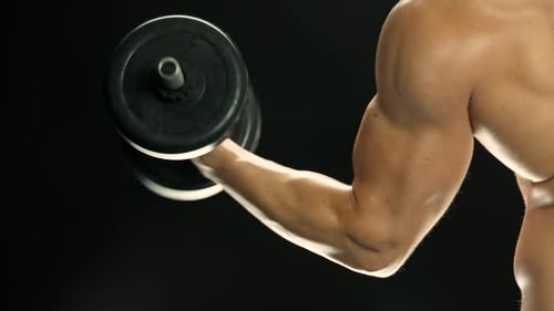 Muscular Arm Doing Bicep Curls With Dumbbell