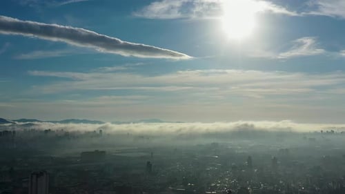 Fog morning at downtown district. Above the clouds.