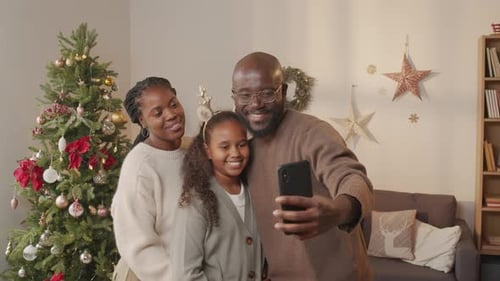 Happy Family Take Christmas Selfie at Home