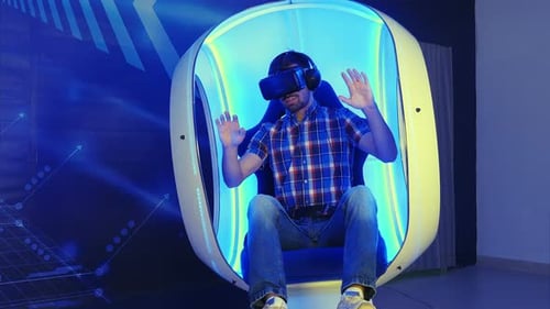 Young Adult Using Virtual Reality Headset and Chair
