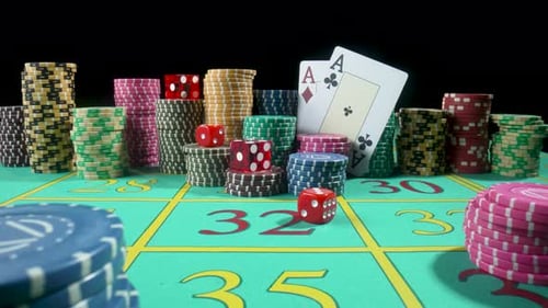 Set of Colorful Chips Playing Cards and Red Dice on a Gaming Table for Gambling in a Casino
