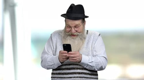 Senior Man Using Smartphone