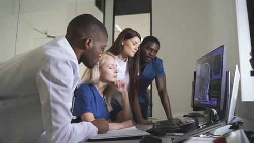 Medical Professionals Reviewing Brain Scan in Hospital
