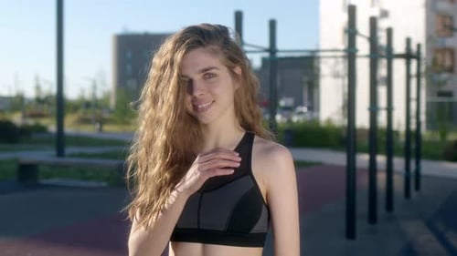Young Woman Smiling on Outdoor Gym Area