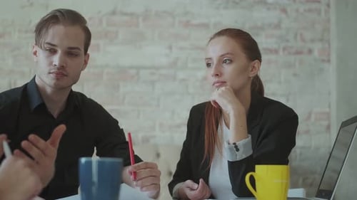 Business Woman Talking with Colleagues at the Negotiations in the Office